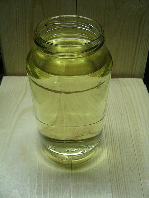Gasoline in a glass jar — fuel illustration