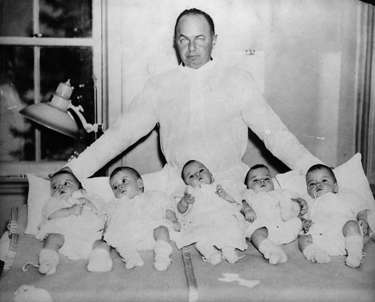 Mitchell Hepburn with the Dionne quintuplets in 1934