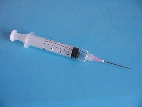 A syringe — medical illustration